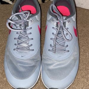 Gray and pink nike shoes